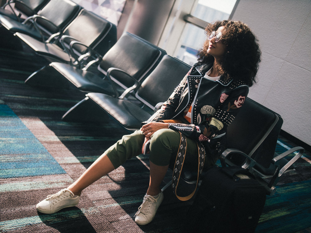 curly travel blogger